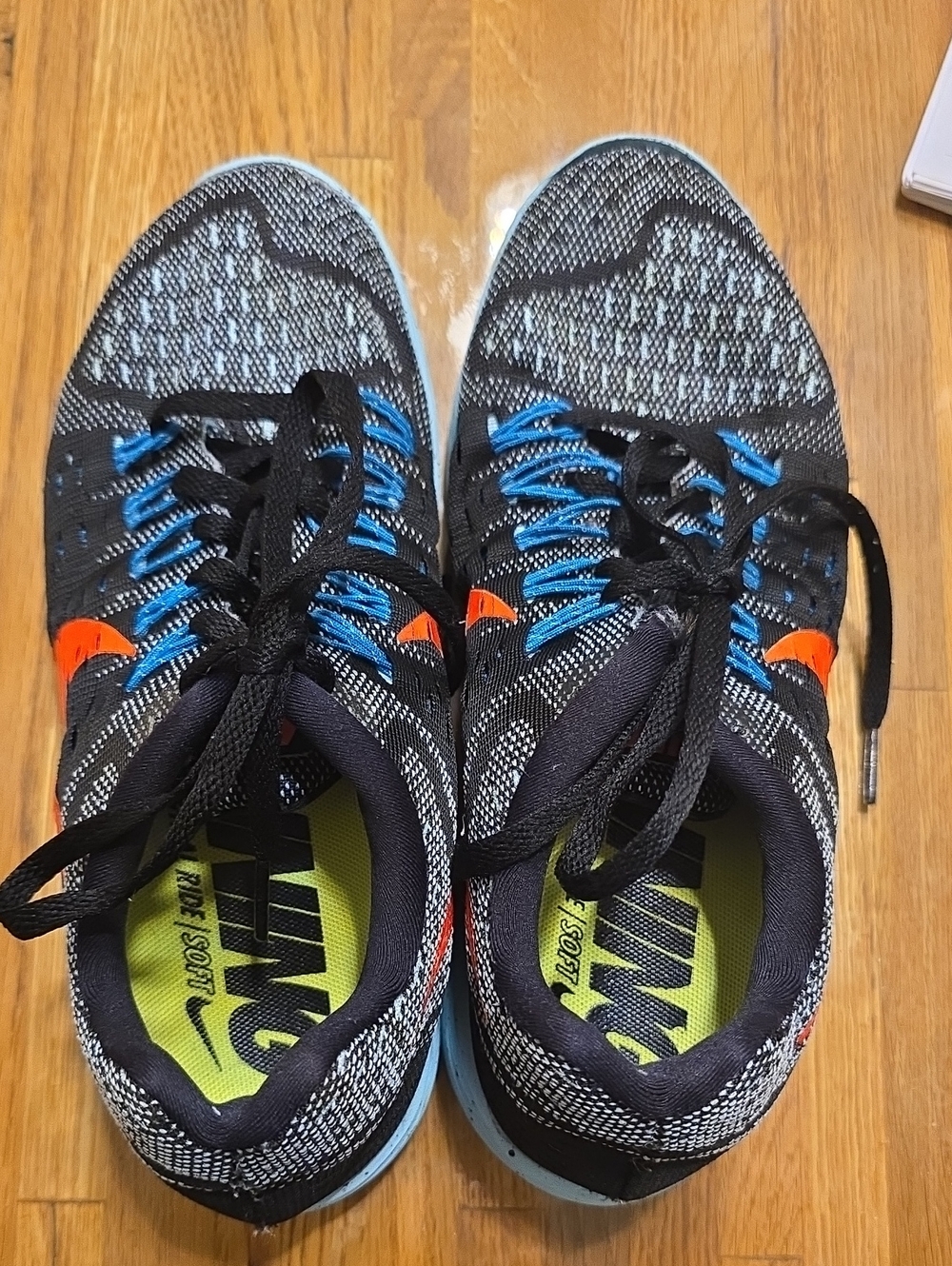 Nike Black Flyknit Sneakers with Blue Laces & Orange Swoosh